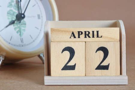 April 22, Cover design with clock in natural concept.の写真素材