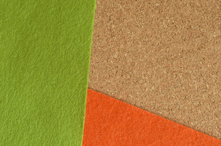 Yellow and green felt fabric on the brown recycle board for background.の写真素材