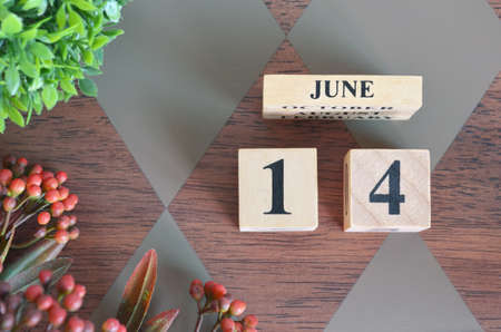 June 14, month. Diamond wood table for background.の写真素材