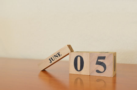 June 5, Date design with calendar cube on wooden table and white background.の写真素材