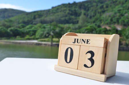 June 3, Date design with number cube on white table, cover design in natural concept.の写真素材