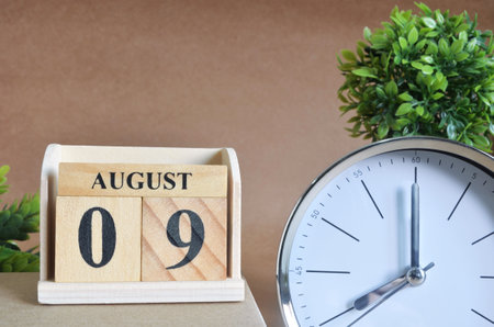 August 9, Cover design with silver - white clock in natural concept.の写真素材
