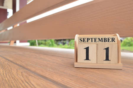September 11, Number cube with wooden balcony background.の写真素材
