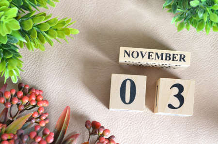 November 3. Number cube in natural concept on white leather for the backgroundの写真素材