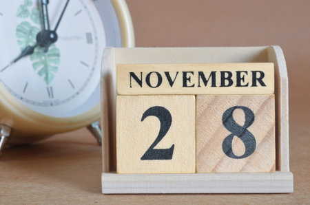 November 28, Cover design with a clock in the natural concept.の写真素材