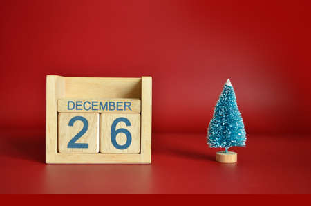 December 26, Calendar design with Christmas tree on red table background.の写真素材