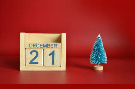 December 21, Calendar design with Christmas tree on red table background.の写真素材