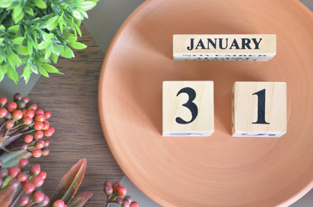 January 31, Date design with flower and earthenware.の写真素材