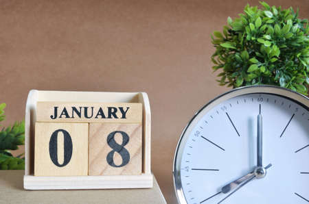 January 8, Cover design with silver - white clock in the natural concept.の写真素材