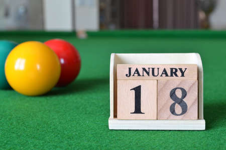 January 18, number cube with balls on snooker table, sport background.の写真素材