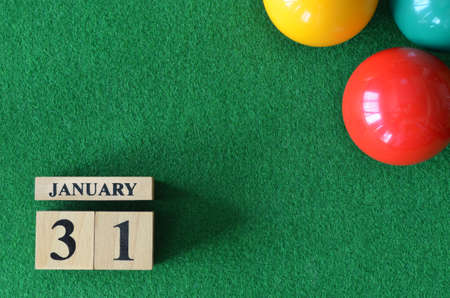 January 31, number cube with balls on snooker table, sport background.の写真素材