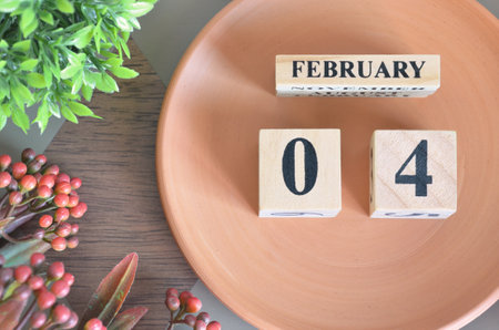 February 4, month design with flower and earthenware.の写真素材