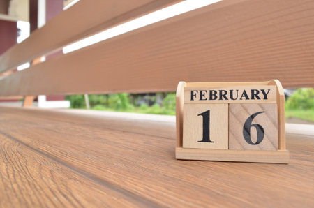 February 16, Number cube with wooden balcony background.の写真素材
