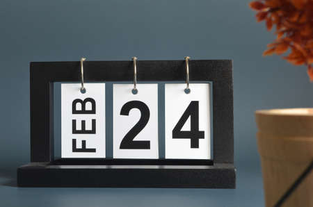 February 24, Date design with a black wooden calendar for a business, Date Plans to the reminder.の写真素材