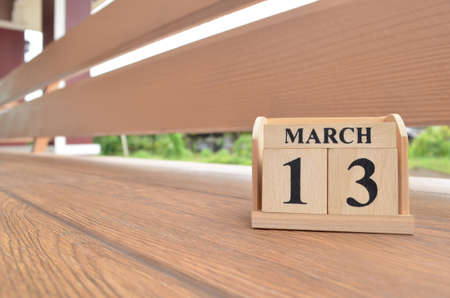 March 13, Number cube with wooden balcony background.の写真素材