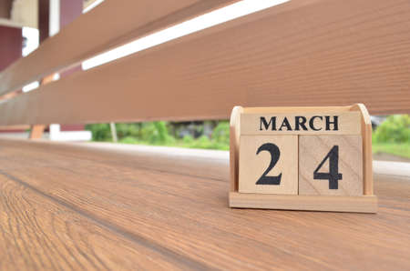 March 24, Number cube with wooden balcony background.の写真素材