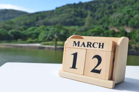 March 12, Date design with number cube on white table, cover design in the natural concept.の写真素材