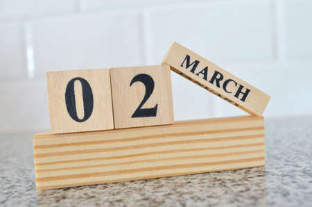 March 2, Cover design with number cube on a white background and granite table.の写真素材