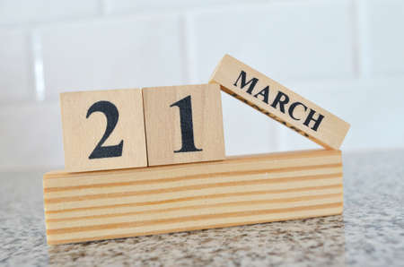 March 21, Cover design with number cube on a white background and granite table.の写真素材