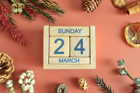 March 24, Cover design with calendar cube, pine cones and dried fruit in the natural concept.の写真素材