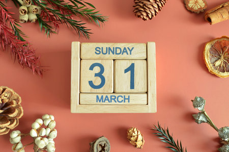 March 31, Cover design with calendar cube, pine cones and dried fruit in the natural concept.の写真素材