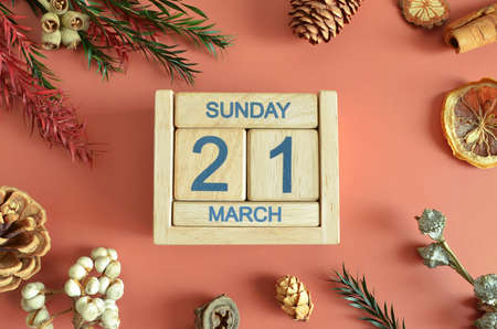 March 21, Cover design with calendar cube, pine cones and dried fruit in the natural concept.の写真素材