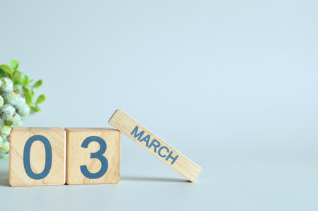 March 3, Calendar cover design with number cube with green fruit on blue background.の写真素材