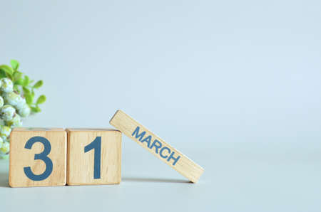 March 31, Calendar cover design with number cube with green fruit on blue background.の写真素材