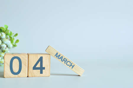 March 4, Calendar cover design with number cube with green fruit on blue background.の写真素材