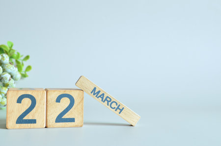 March 22, Calendar cover design with number cube with green fruit on blue background.の写真素材