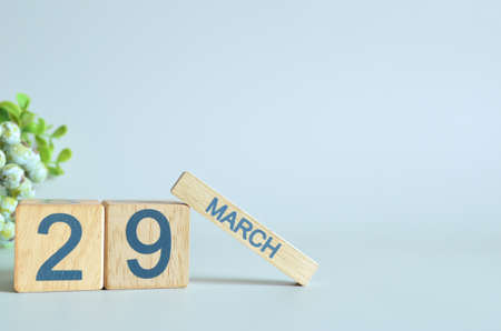 March 29, Calendar cover design with number cube with green fruit on blue background.の写真素材