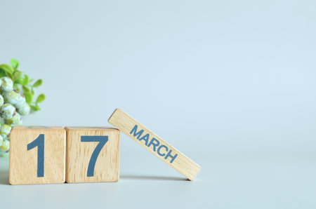 March 17, Calendar cover design with number cube with green fruit on blue background.