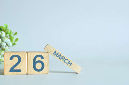 March 26, Calendar cover design with number cube with green fruit on blue background.の写真素材