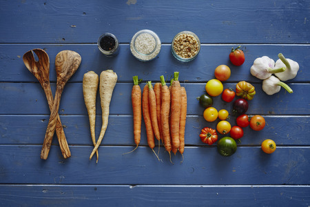 autumnal vegetables on blue vintage wooden plateの写真素材