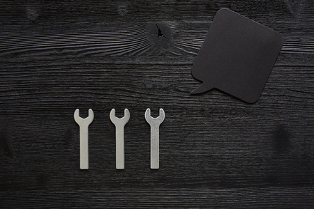 three small wrenches with speech bubbleの写真素材