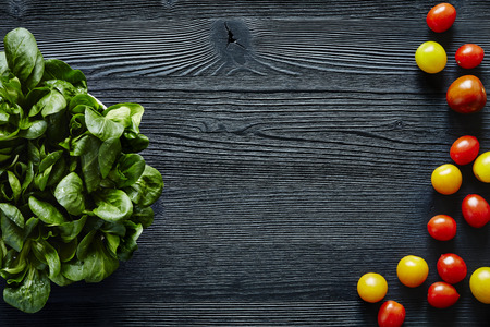 green fresh salad and colorful tomatoesの写真素材
