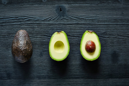 three states of avocado original halfed and stone