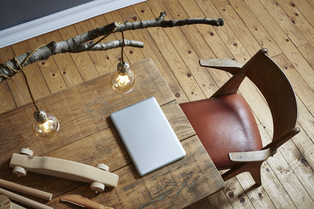 creative and beautiful workspace laptop and wood carvingの写真素材