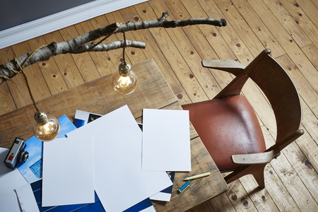 photographer workspace bbirch lamp pictures on wooden tableの写真素材