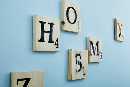 wooden puzzle letters on a wall