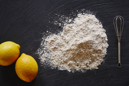 dark slate worktop in foodist kitchen flour and lemonsの写真素材