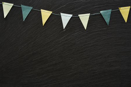 colorful garland on slate blackboard invitation cardの写真素材