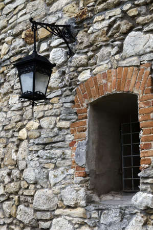 Old torch beside window in Olesikoの写真素材