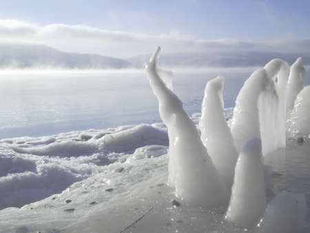 Figures from the icicles on the river in winterの写真素材