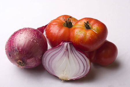 tomatos and onions on whiteの写真素材