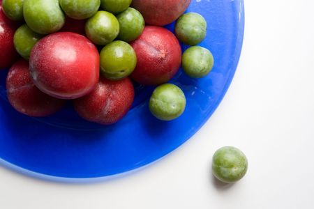 some fruit of sumer in a blue plateの写真素材