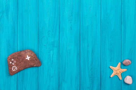 Stone game pad and sea elementsの写真素材