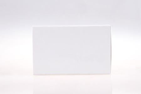 Pils or capsules carton package on gray backgroundの写真素材