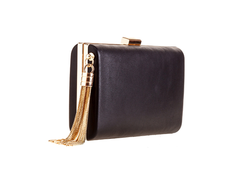 Black leather clutch classic rectangular shape with golden set of chains at the side on a white background in the studio. It stand in a half-turn.の写真素材