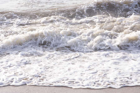 Soft wave of the sea on the sandy beach の写真素材
